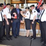 Acting Governor pinned with first poppy Acting Governor pinned with first poppy